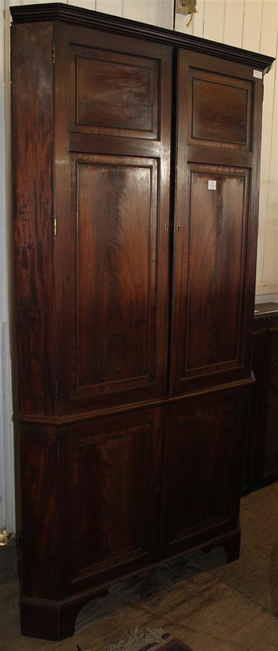 Large figured mahogany standing corner cupboard, 18th century and later